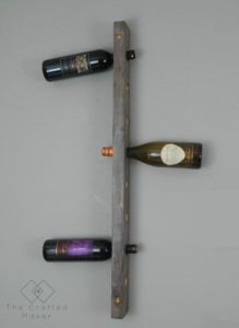 Build this DIY hanging wine rack out of one 2X4 board. For less than a bottle of wine, you can display your wine selection in style. 