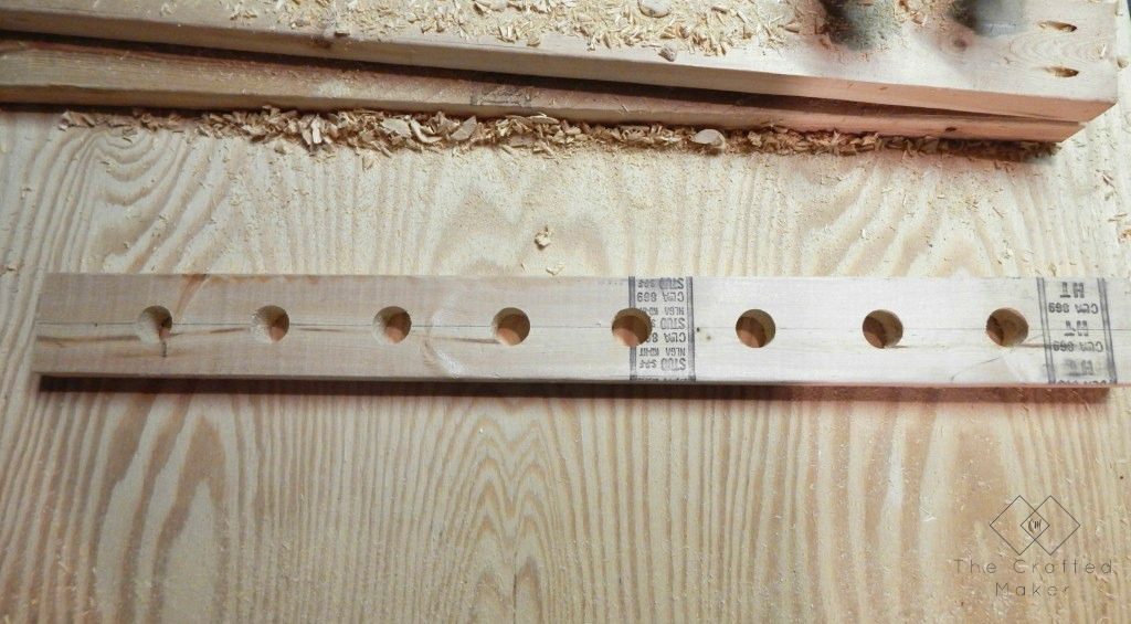 Build this DIY hanging wine rack out of one 2X4 board. For less than a bottle of wine, you can display your wine selection in style.