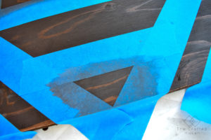 Make this fun geometric scrap wood wall art with scrap wood and paint you already have on hand. This is a quick, colorful, and creative afternoon project!