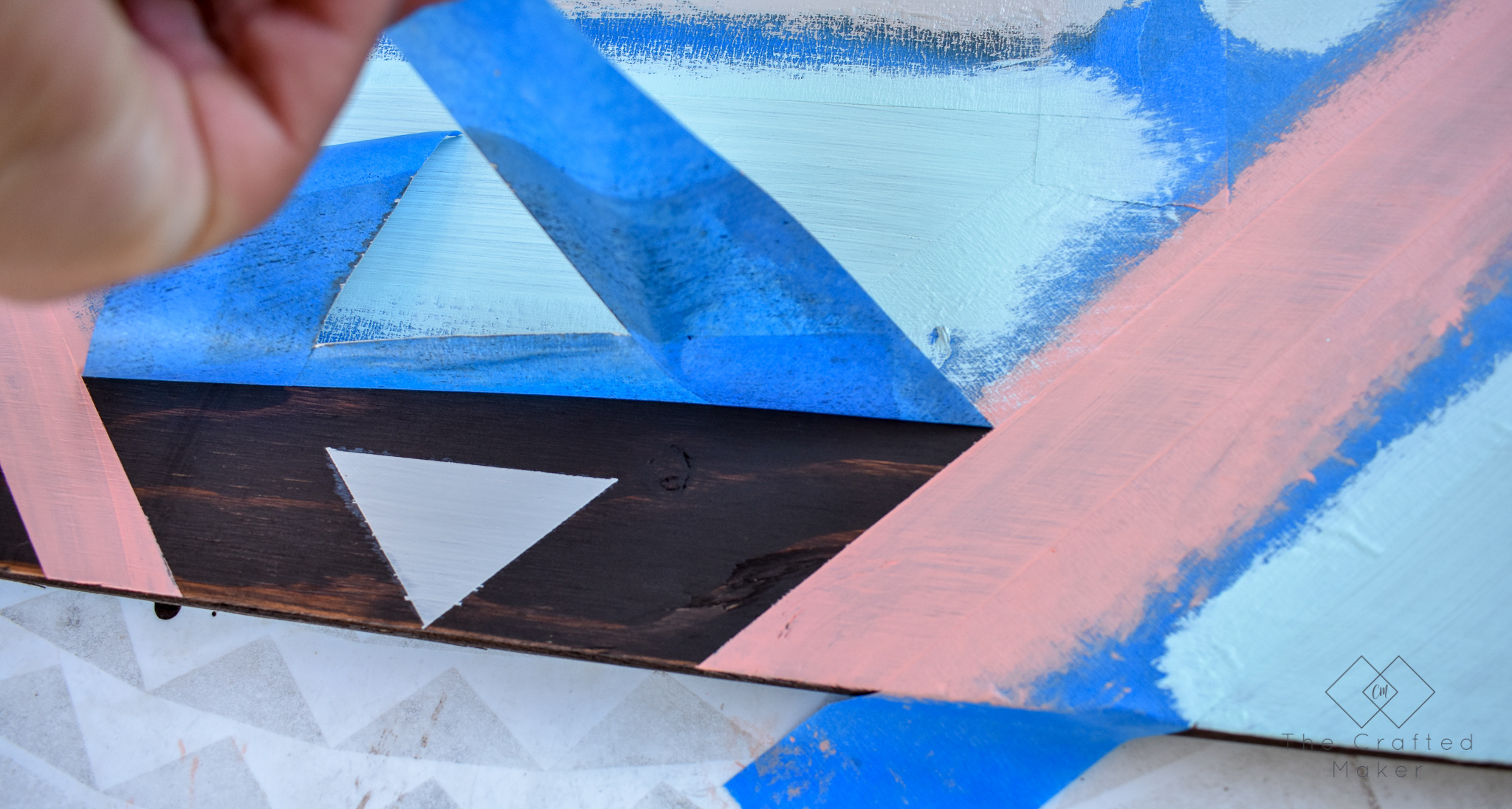Make this fun geometric scrap wood wall art with scrap wood and paint you already have on hand. This is a quick, colorful, and creative afternoon project!