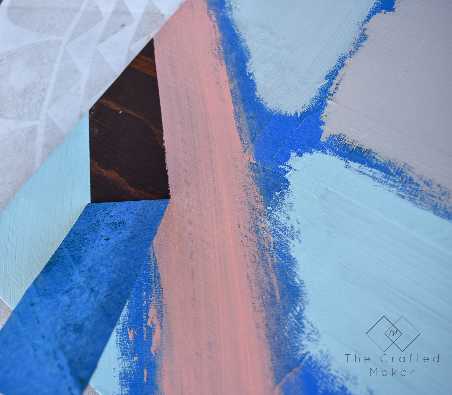 Make this fun geometric scrap wood wall art with scrap wood and paint you already have on hand. This is a quick, colorful, and creative afternoon project!