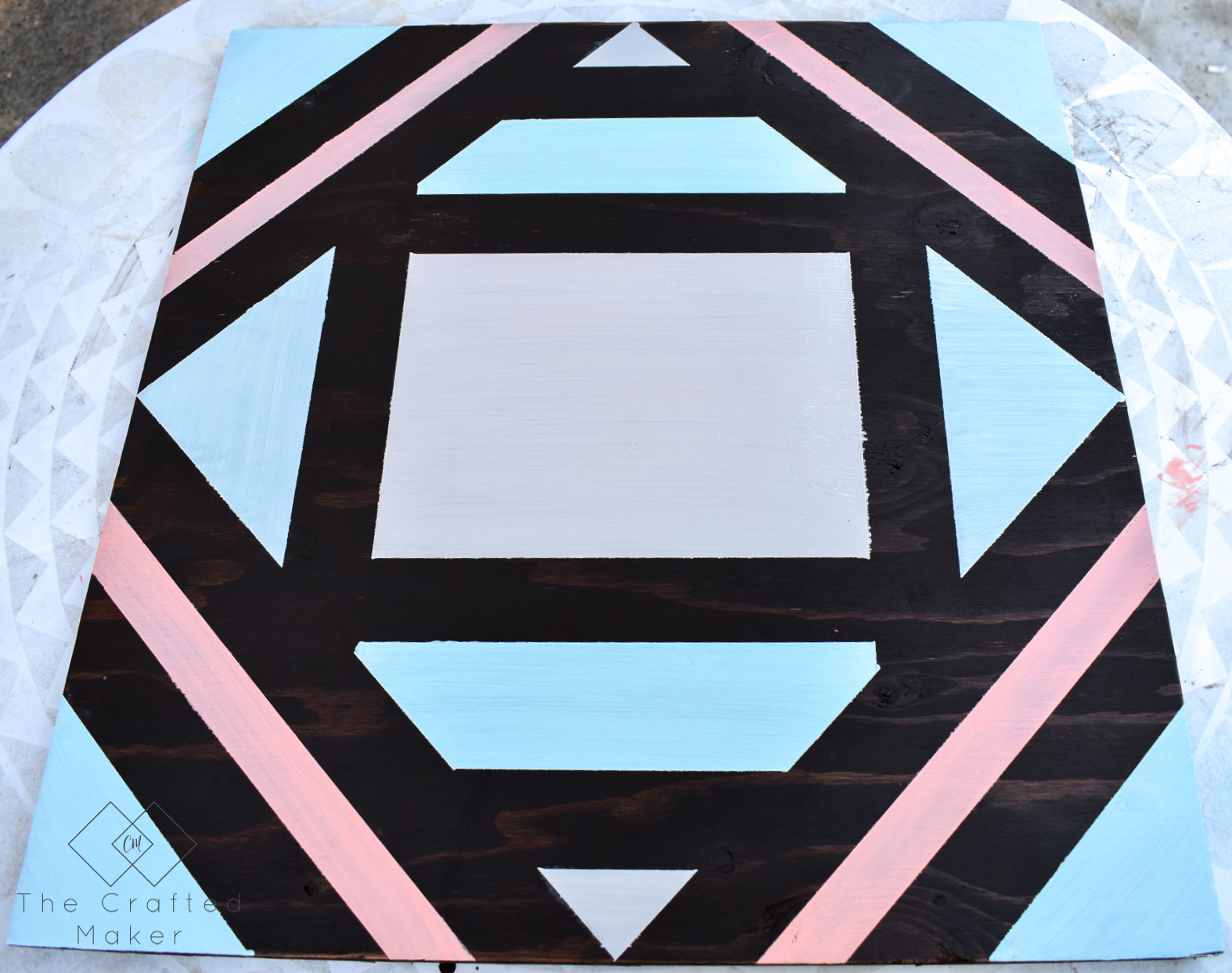 Make this fun geometric scrap wood wall art with scrap wood and paint you already have on hand. This is a quick, colorful, and creative afternoon project!