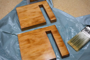 This Scrappy Saturday project is sliding bookends for open shelving. These sliding bookends are a great addition to any room with open shelving. This is a fun and quick project to complete!
